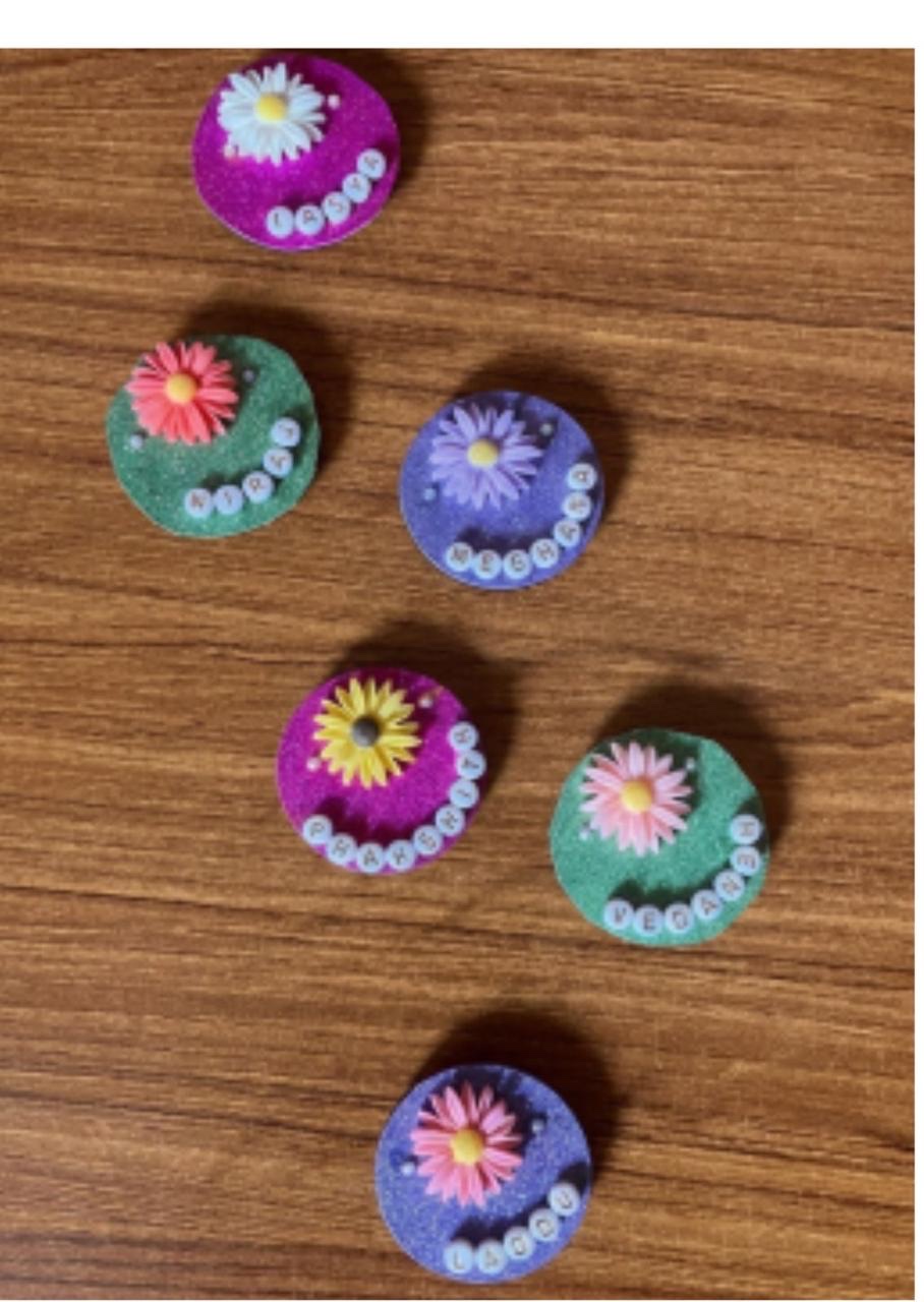 Felt flower fridge magnets in purple, green and pink