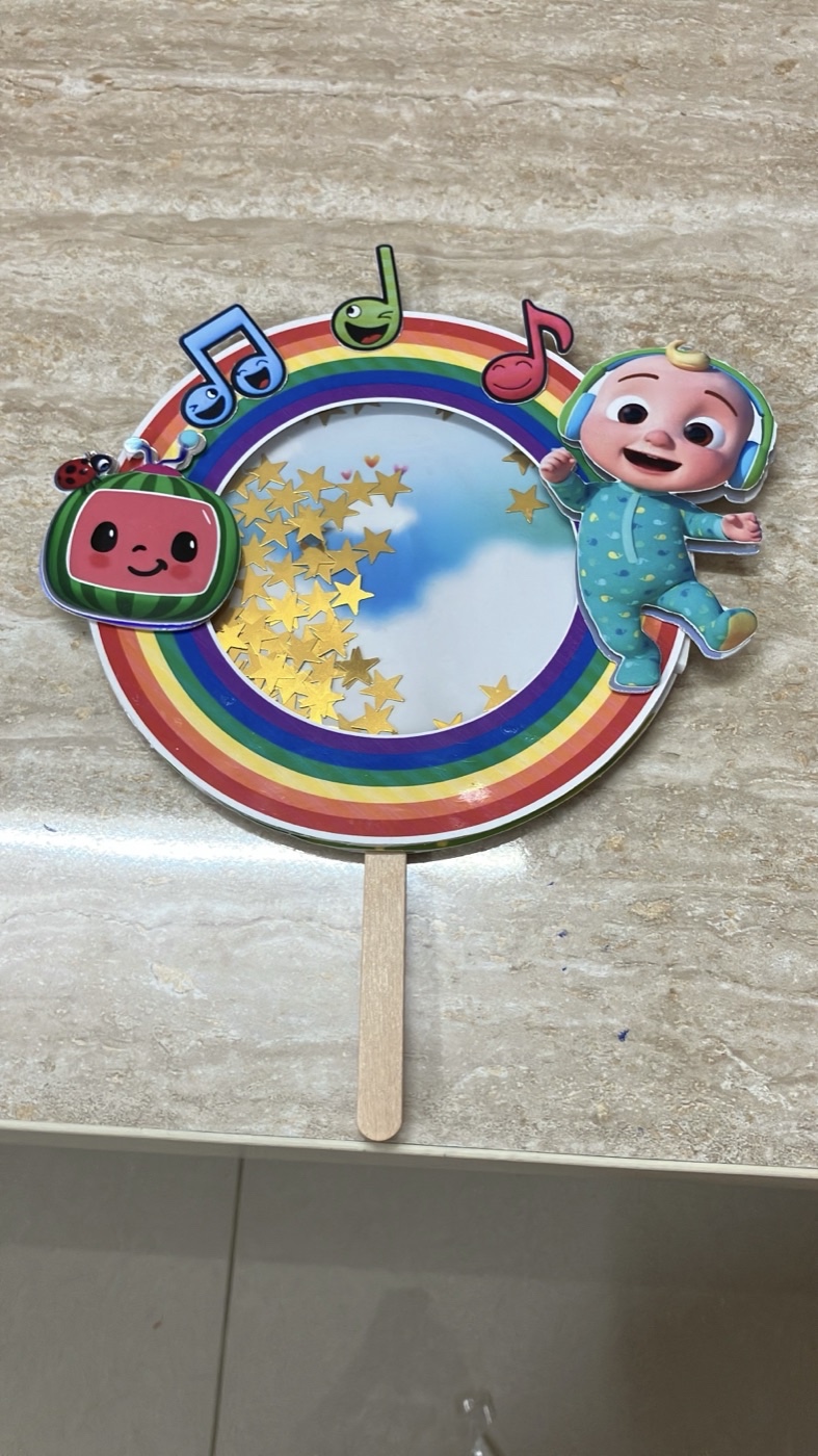 Cocomelon rainbow shaker cake topper filled with gold stars