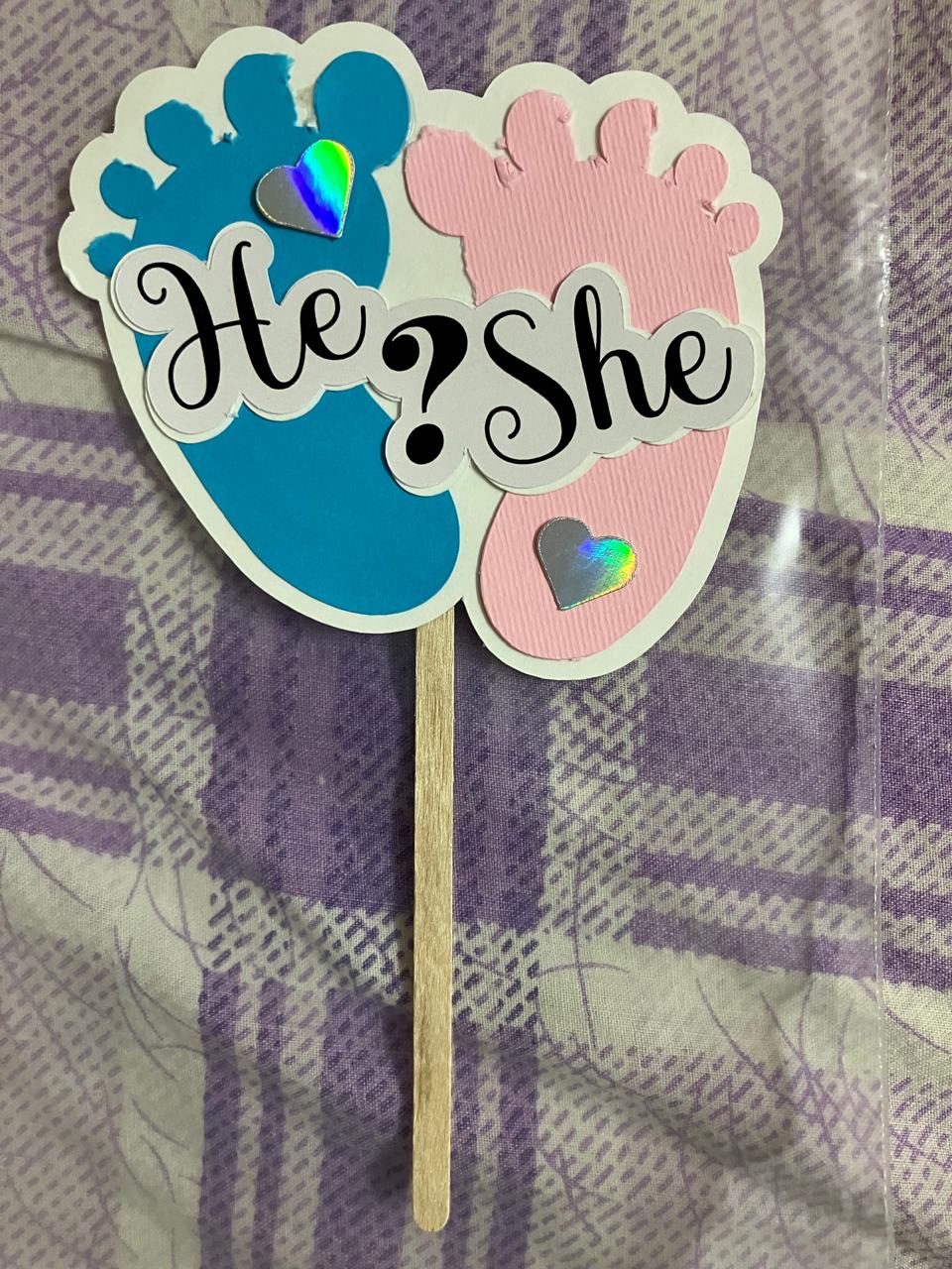 He or She gender reveal topper with baby feet in blue and pink