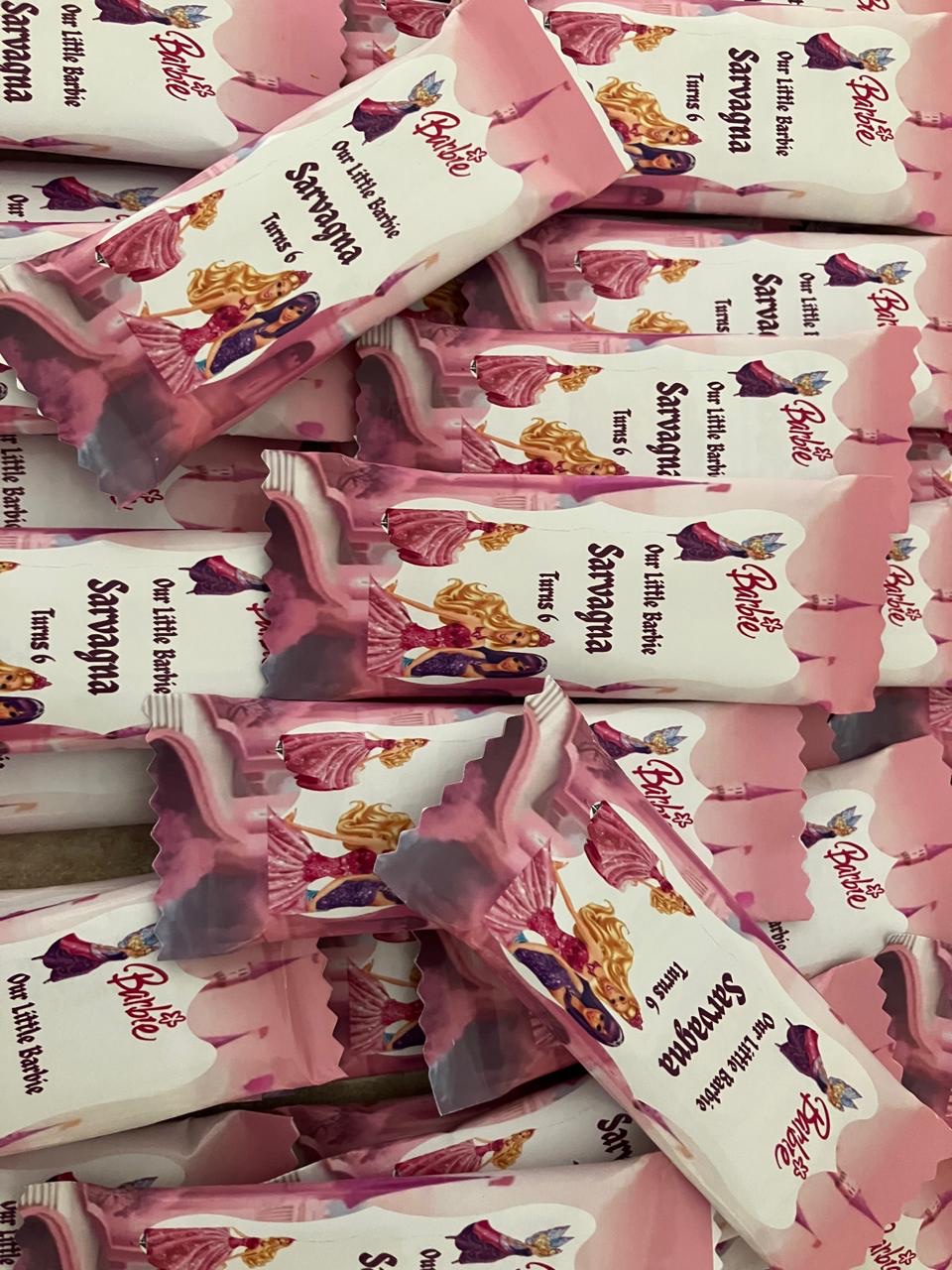Pink Barbie themed personalised chocolate wraps stacked together